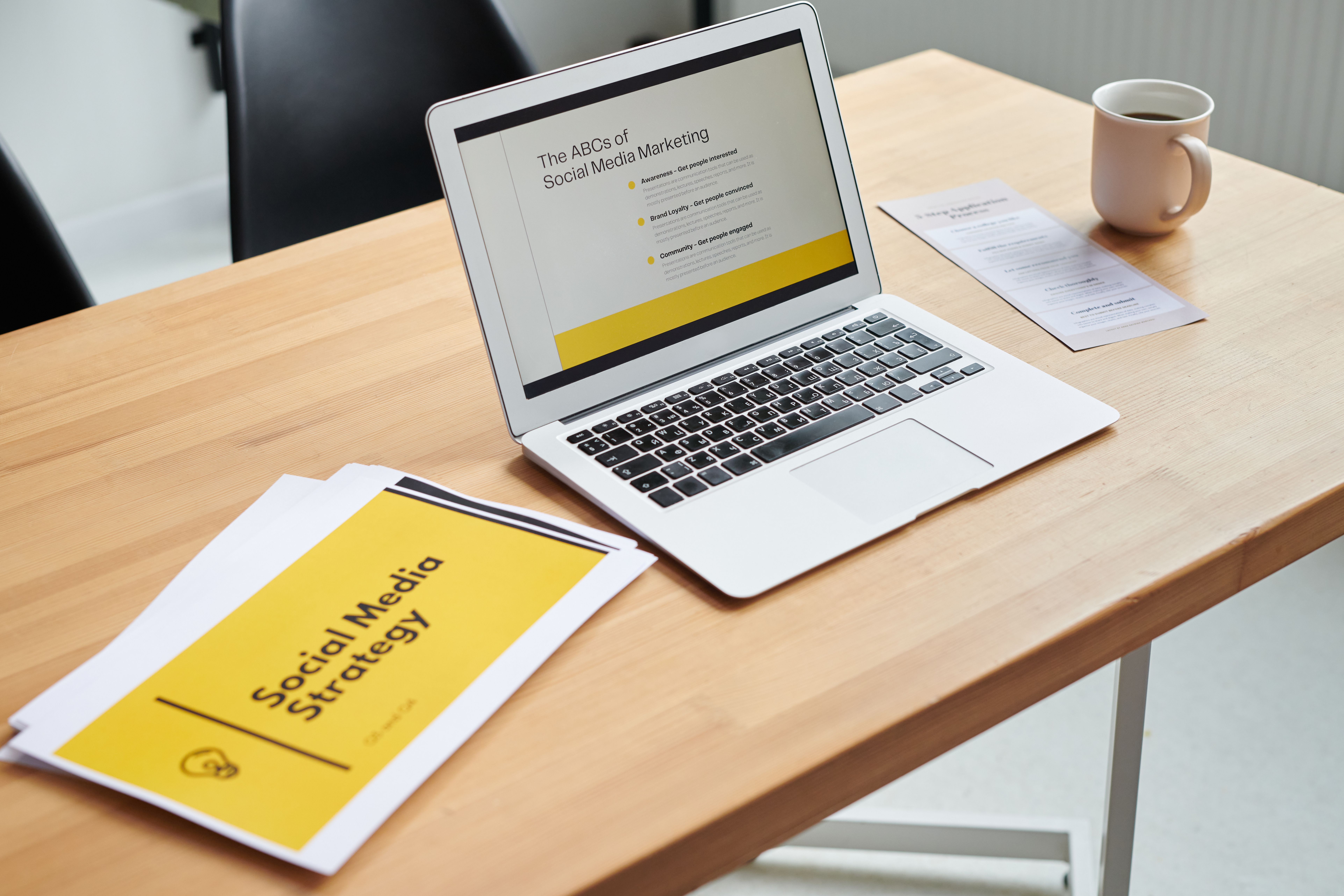 Laptop showing a social media marketing strategy on a modern workspace